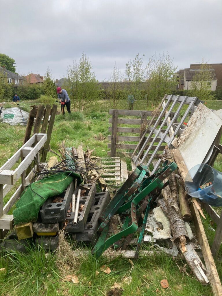 Large items of rubbish found during a clean-up, including pallets, bricks and large pieces of metal